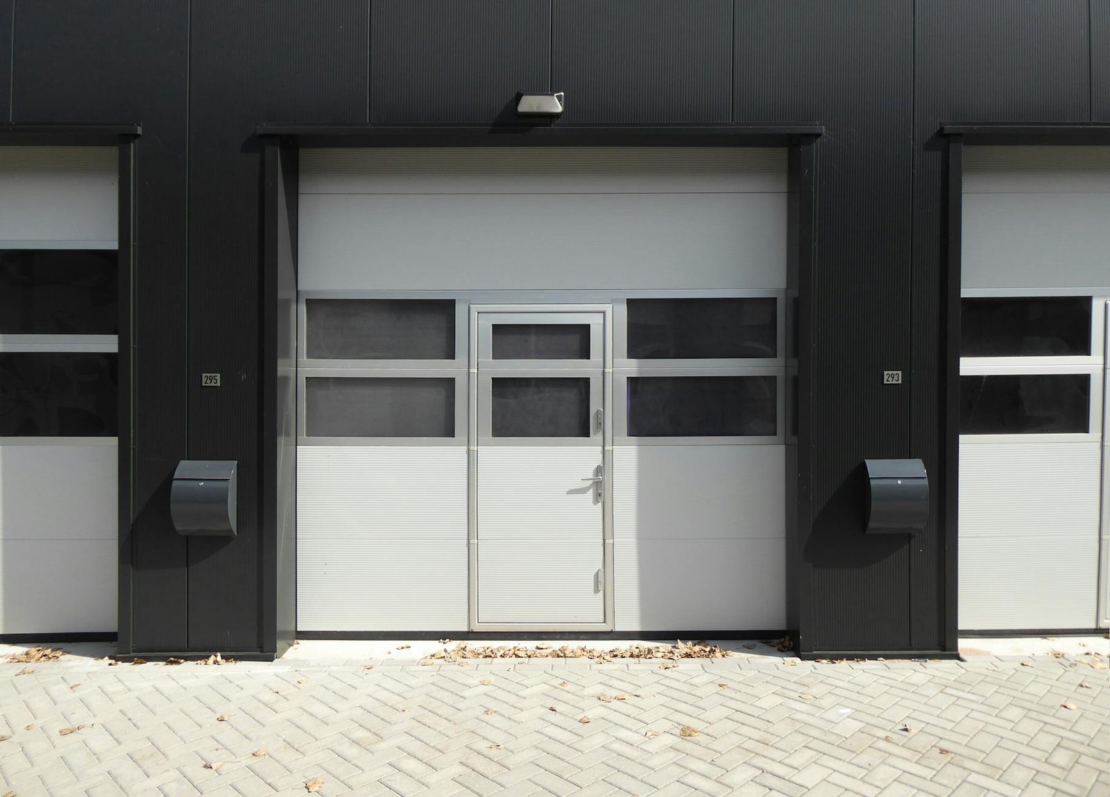 Finished garage wall storage system with organized tools and equipment
