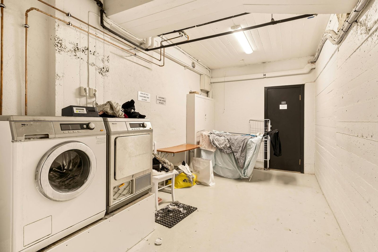 Multi-functional furniture and space-saving solutions in tiny laundry room