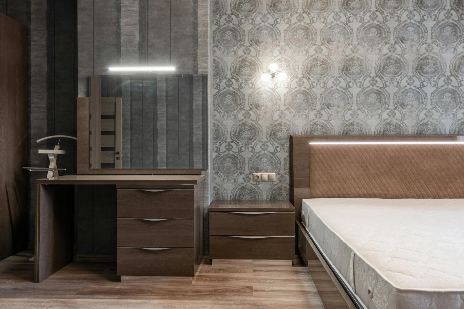 Clean bedroom surfaces with minimal items and warm lighting