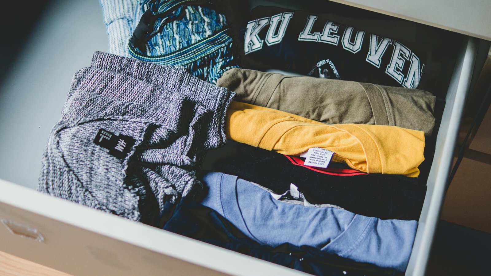 Organized drawer with neatly folded undergarments and small clothing items