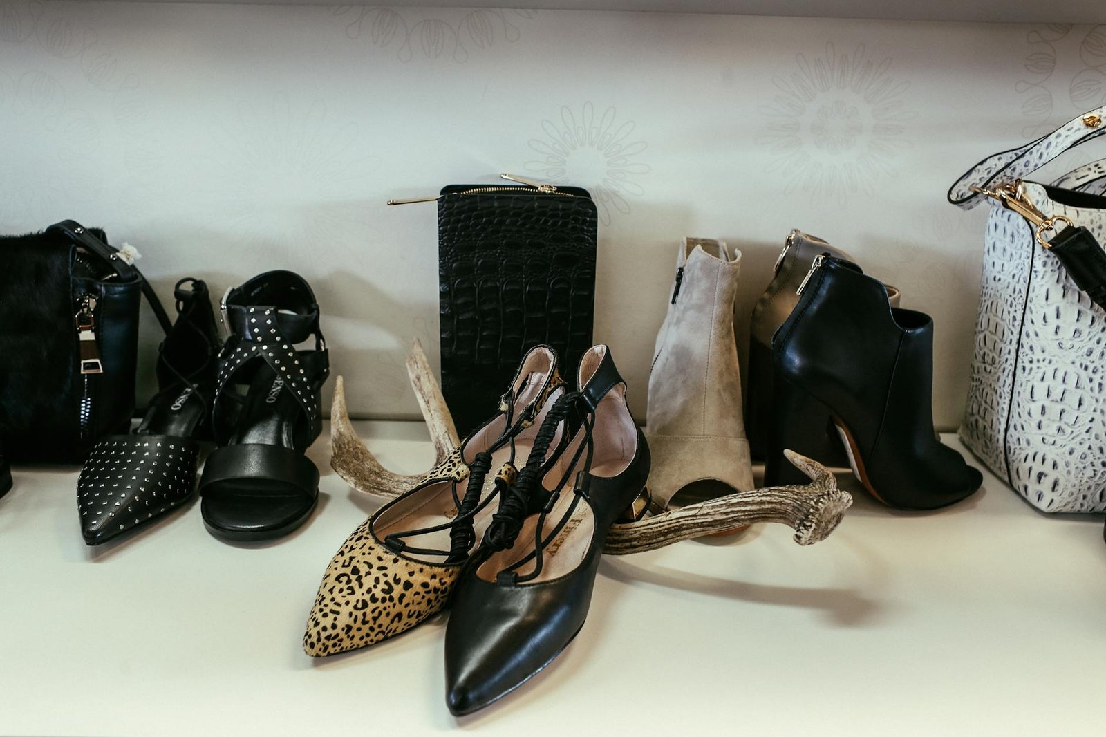 Handbags with smaller purses nested inside for space-saving storage