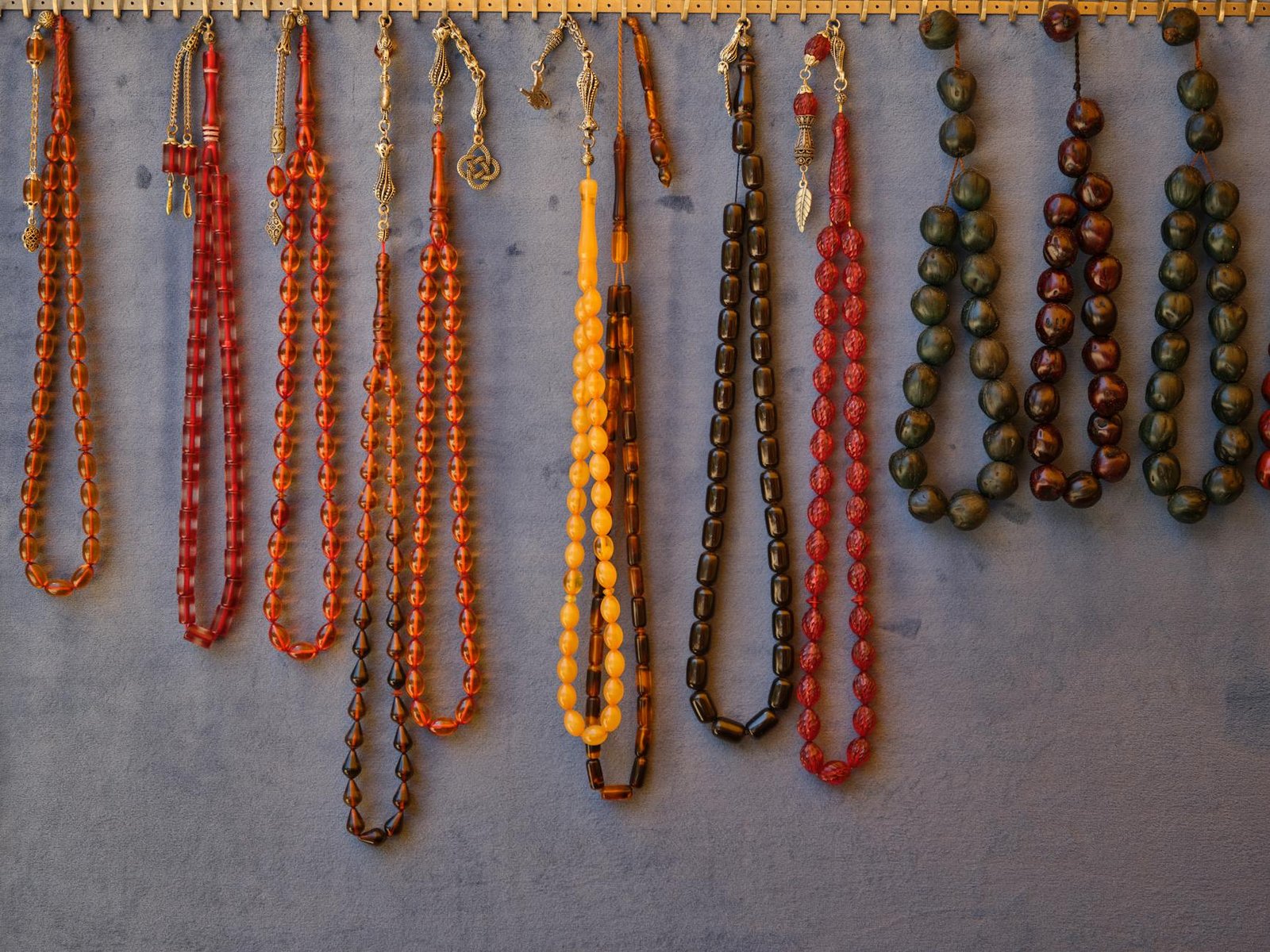 DIY Branch Jewelry Display Wall-mounted wooden branch used as jewelry display for necklaces