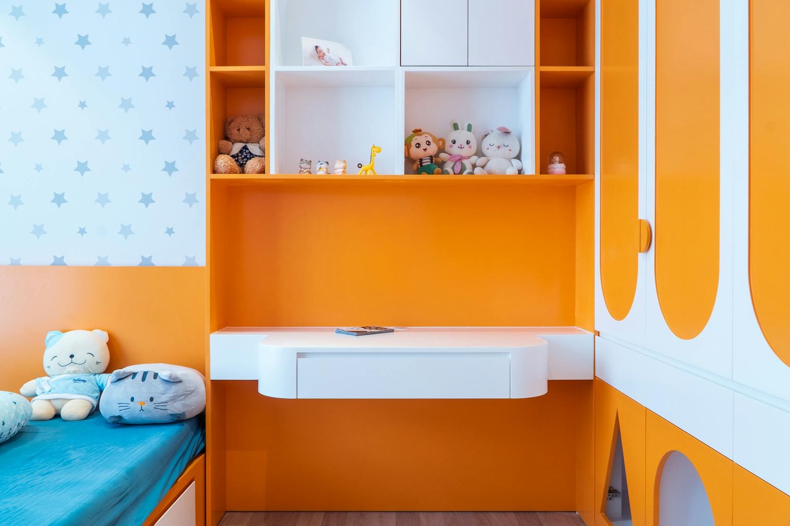 Shared bedroom with distinct zones for different aged children