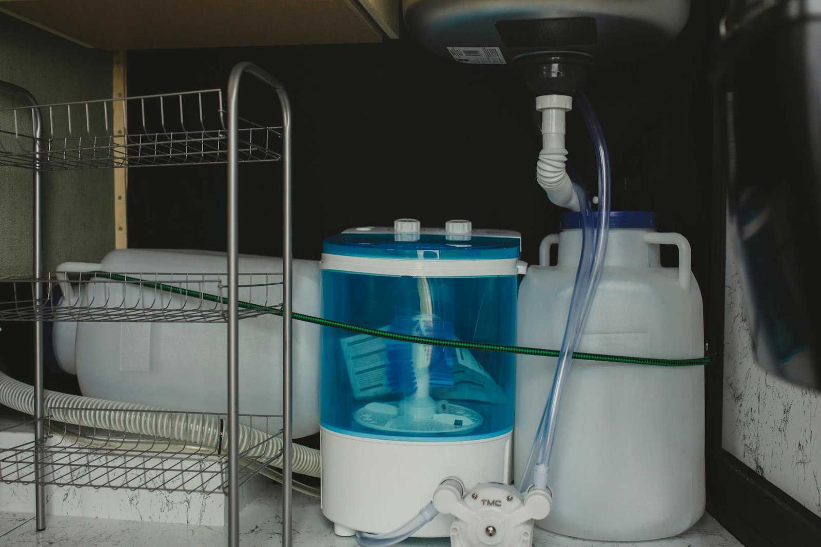 Organized under-bed storage with clear containers and labeled sections