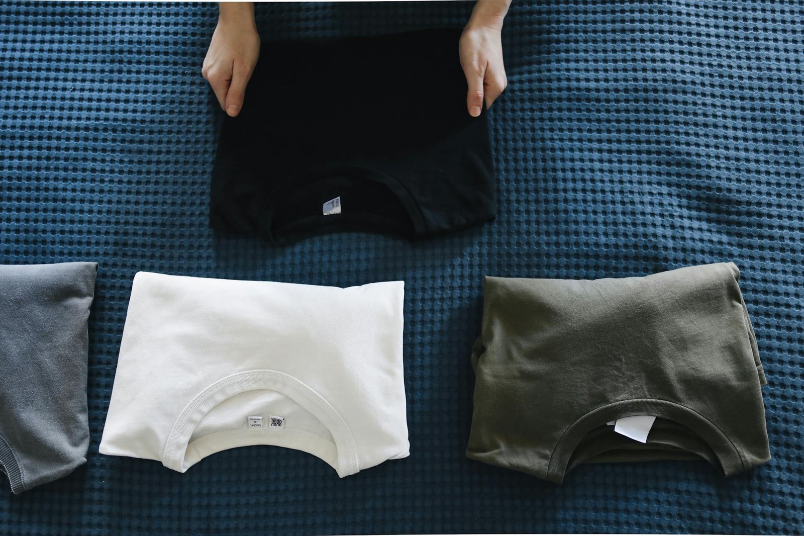 Underwear folded using the thirds method and neatly stacked in drawer compartments