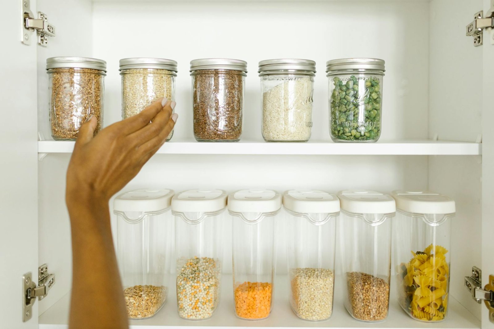 Zone-based canned goods organization system Pantry shelves with canned goods organized by zones and labeled shelf edges