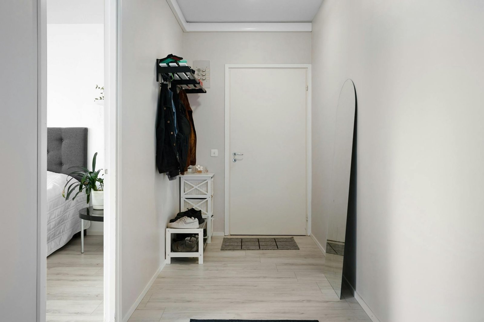Over-door shoe organizer with clear pockets holding various shoes